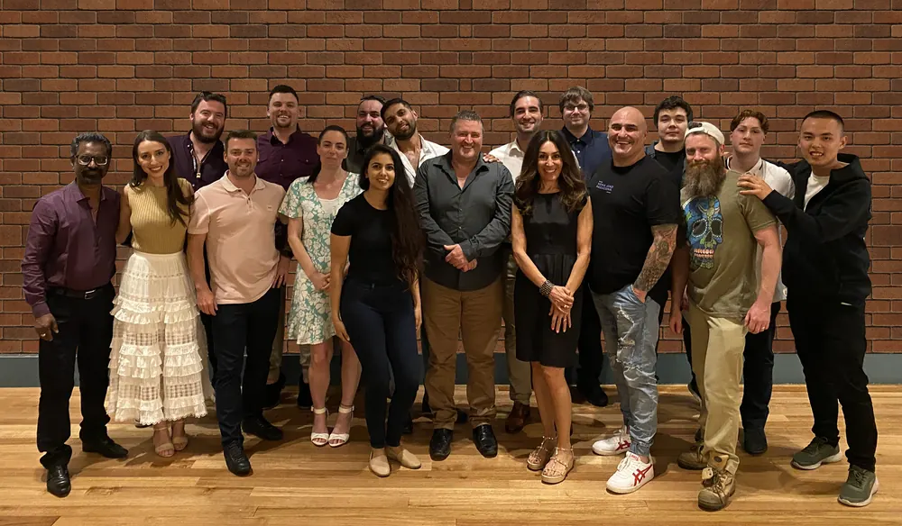 A team photo celebrating the launch of portable fog systems